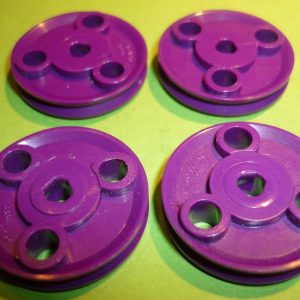 Four Meccano tri-axle plastic pulleys, part 22CP3P, purple