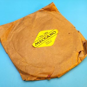 Meccano paper trade packet of one red 4" Circular Plate, part 146a.